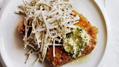 Crumbed pork chops with anchovy butter and celeriac chilli remoulade