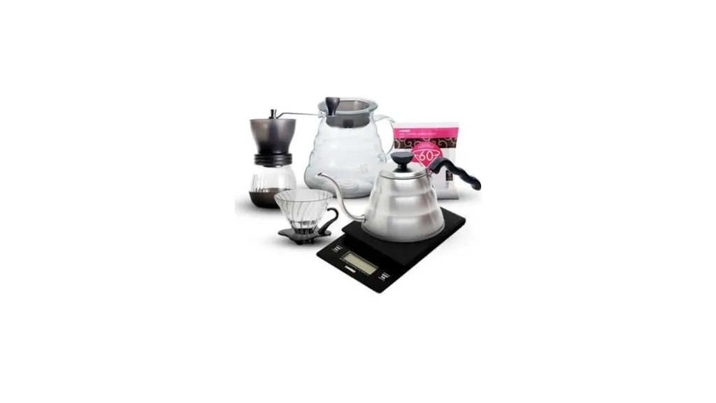 The Hario complete pour over bundle includes a V60 02 dripper, glass server, gooseneck kettle, coffee scales, manual coffee grinder and filters.