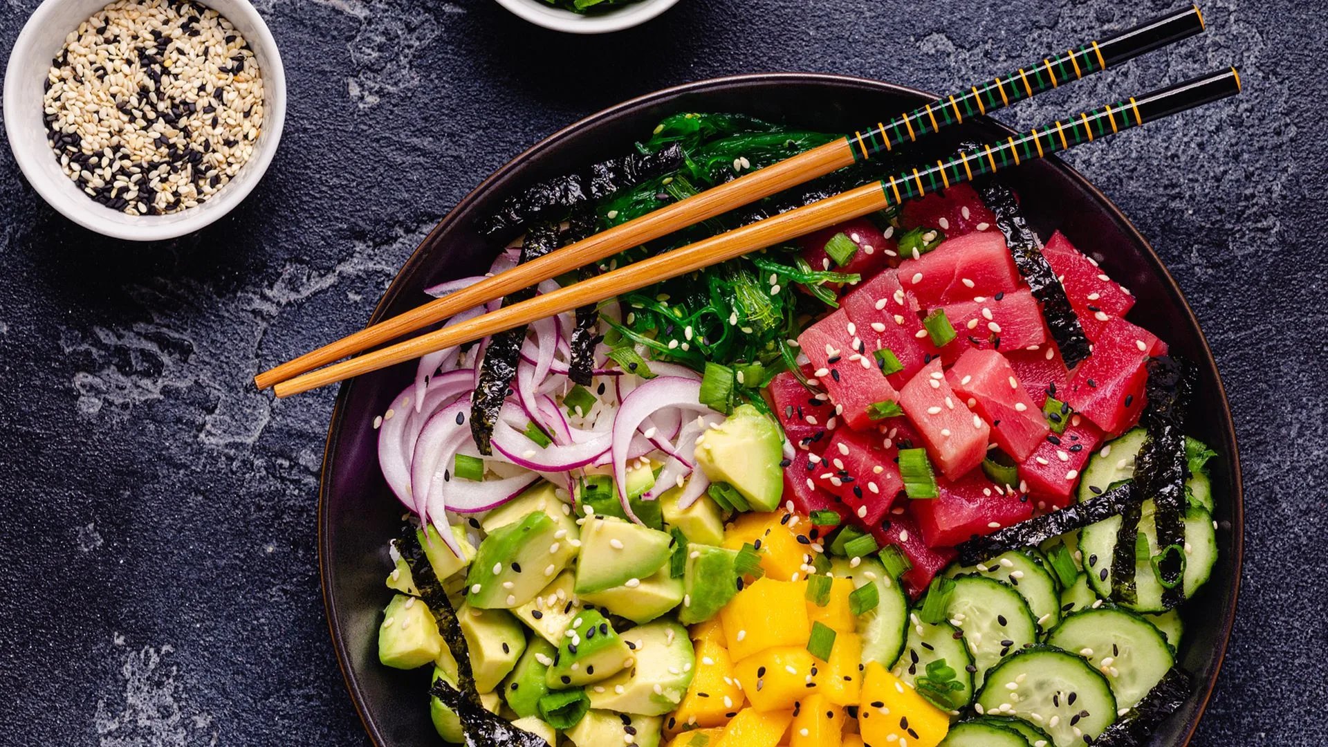 Hawaiian tuna poke bowl with seaweed avocado mango cucumber