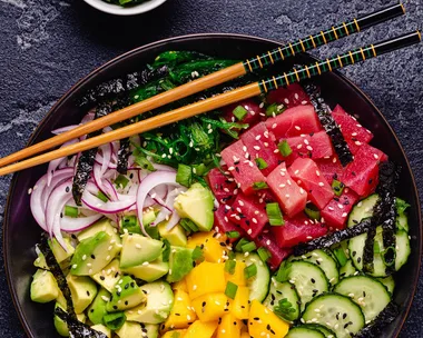 Hawaiian tuna poke bowl with seaweed avocado mango cucumber