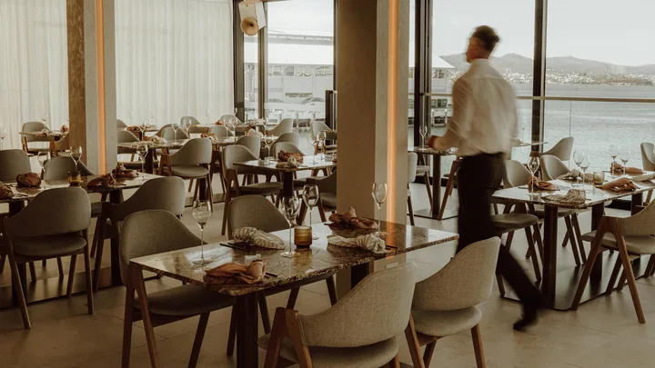 Best new restaurant Finalist Maria in hobart's neutral dining room with waiter walking past tables