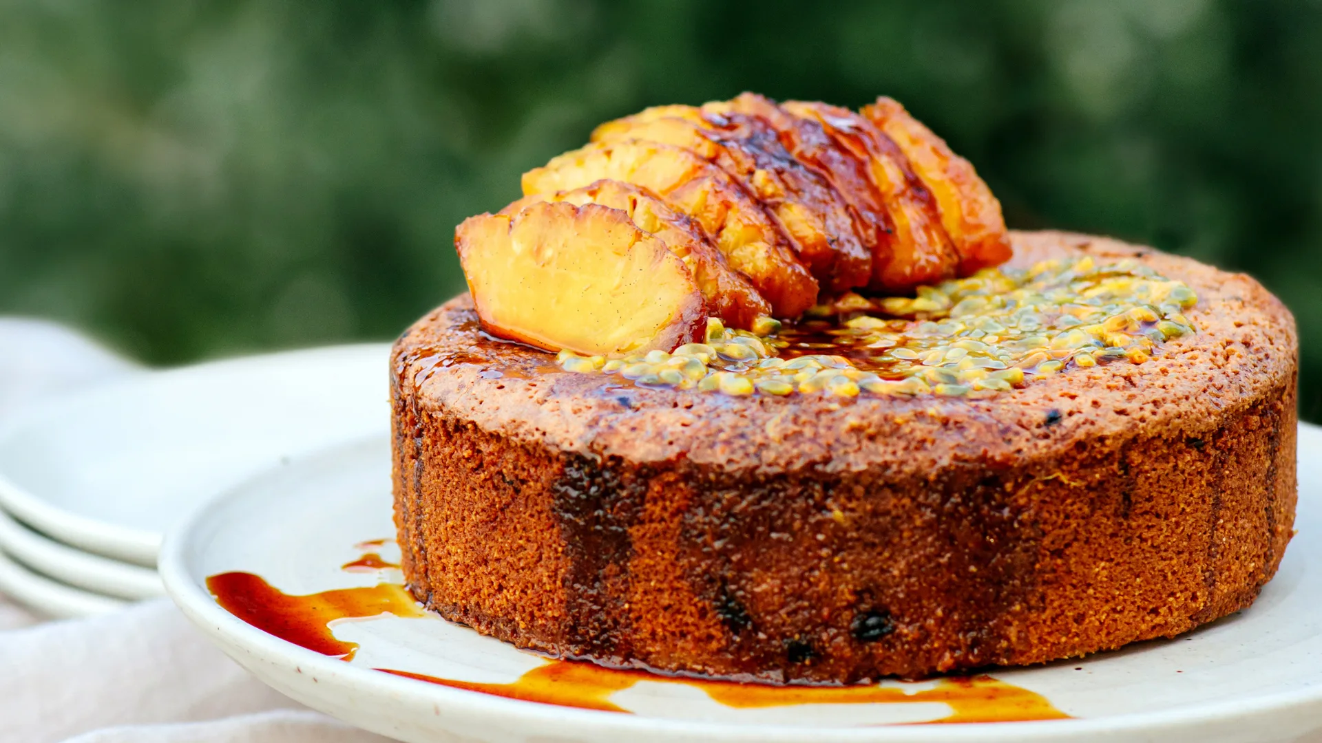 Gluten-free passionfruit and almond cake with honey-roasted pineapple by Frida's Field