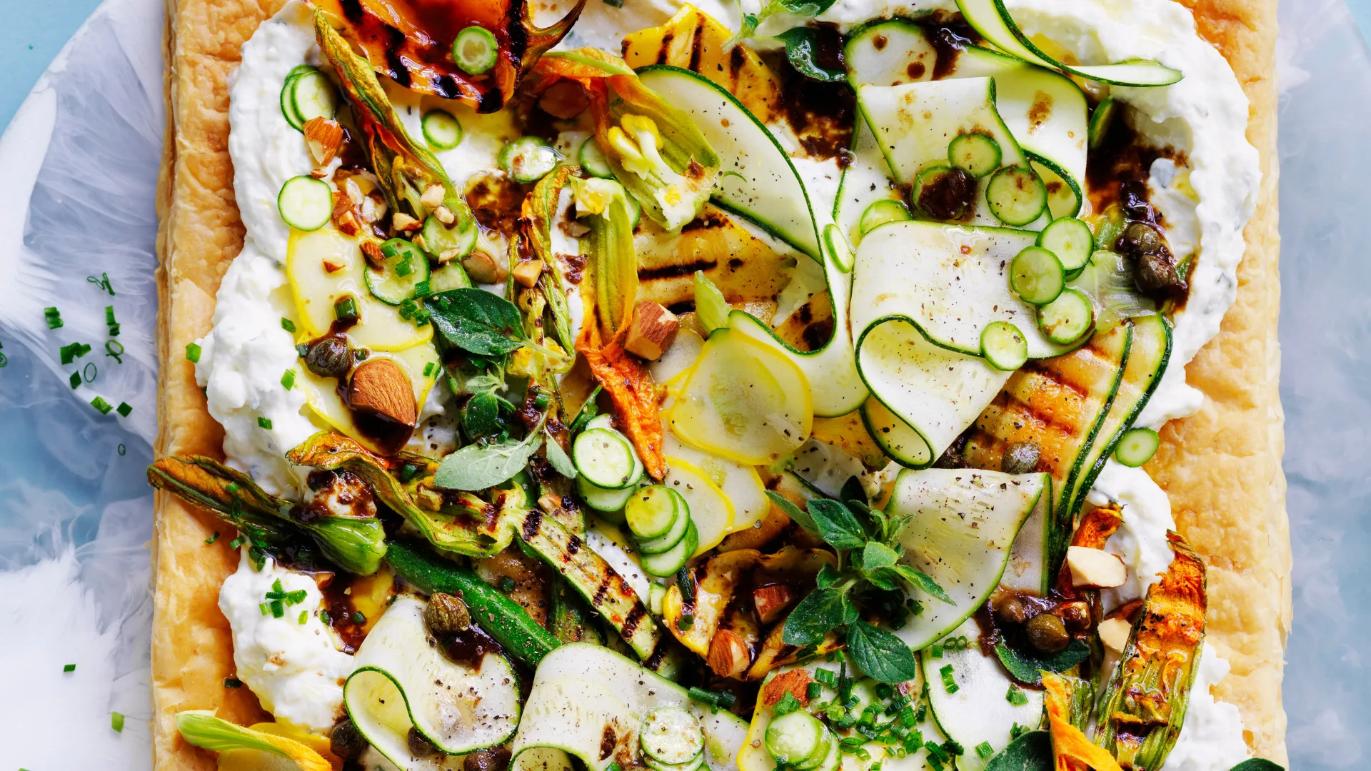 Salted ricotta with zucchini and black garlic tart