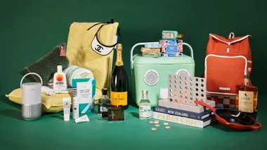 a selection of gifts set against a green backdrop