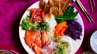 Bird's eye view of a Prosperity salad on a pink table