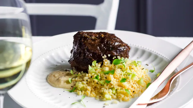 Braised beef cheek, burghul salad, and bread and anchovy sauce