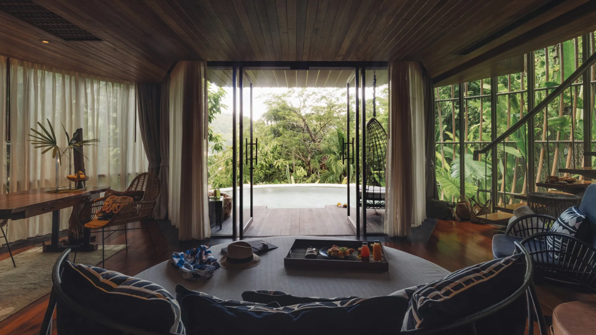 A hotel room at Kemeela wellness resort in Phuket, surrounded by greenery.