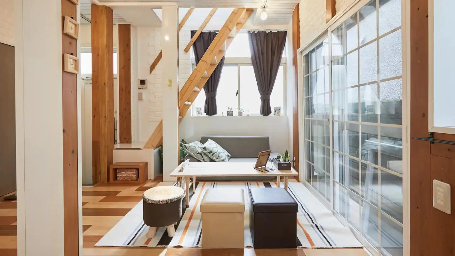 The living space and windows at Matsuri Loft House Airbnb Tokyo stay