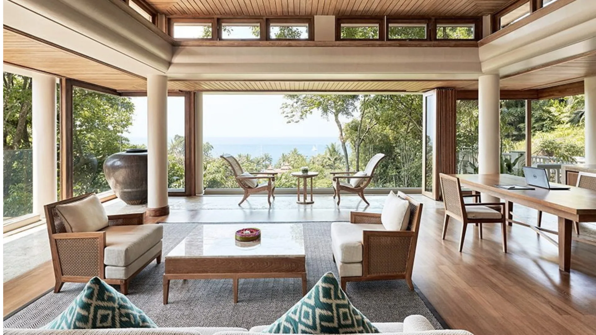 Views overlooking lush greenery and the ocean at Trisara on the Thai island