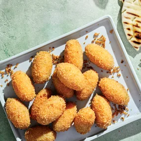 cheese croquettes on baking dish.