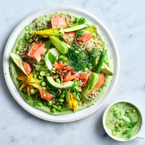 Hot-smoked salmon and pearl barley salad on white plate with avocado dill dressing on side.