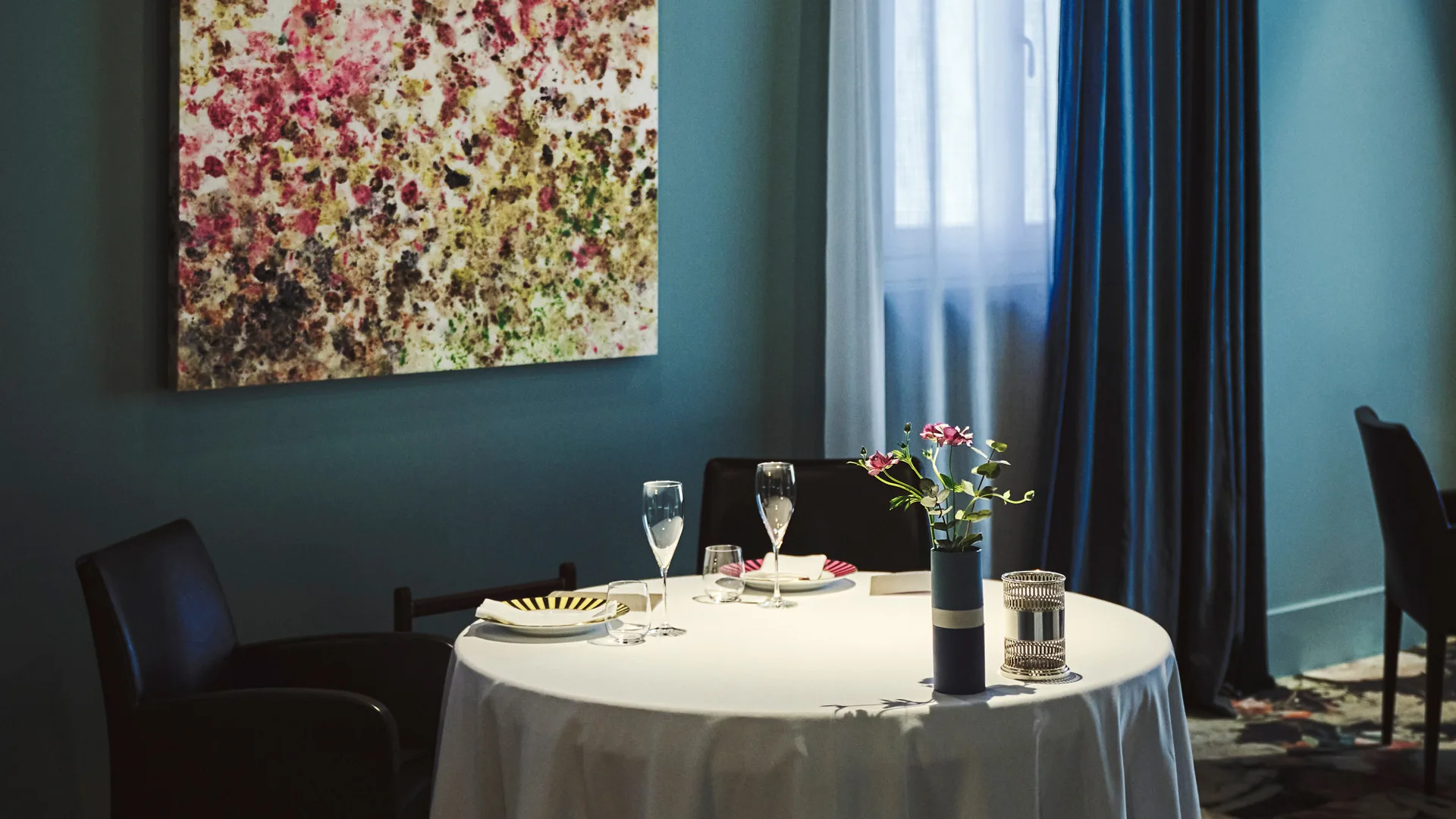 Ostera Francescana Michelin-star restaurant Italy interior with table setting and artwork