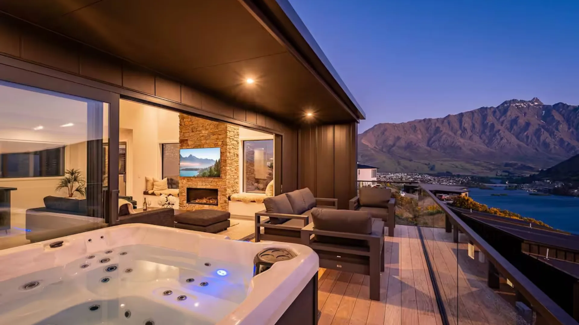 Uninterrupted views of Lake Wakatipu and The Remarkables range from the outdoor tub at Summit Escape.