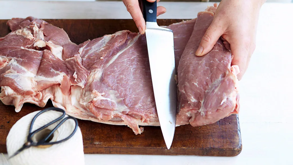 Porchetta is stuffed with a mixture of herbs, so the meat needs to be butterflied first.