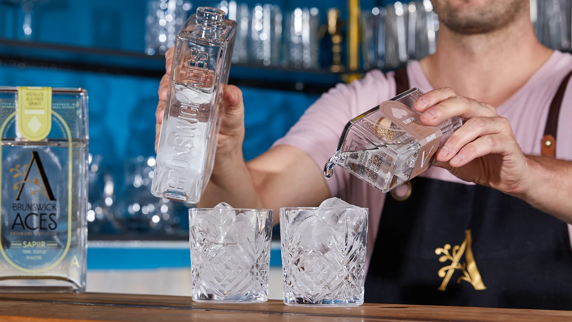 Zero-proof spirits at Aces Brunswick have inspired more non-alcoholic bars in Australia. Photo of bartender mixing cocktails at bar