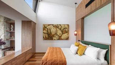 Luxury Adelaide hotel bedroom with painting and skylight at Sequoia Lodge in the Adelaide Hills