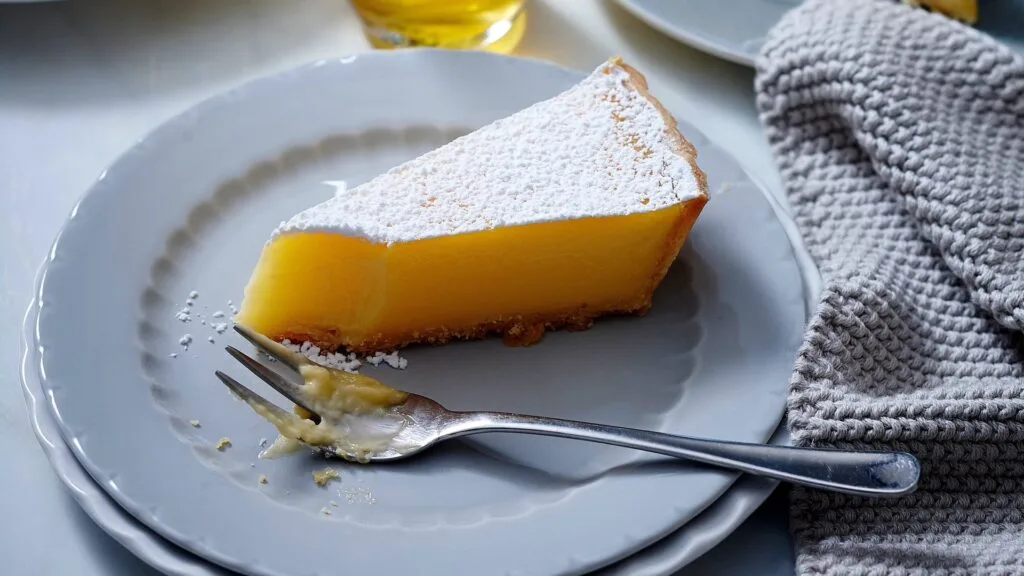 Lemon tart is best eaten on the day it's made, after cooling in the tin to avoid cracks.