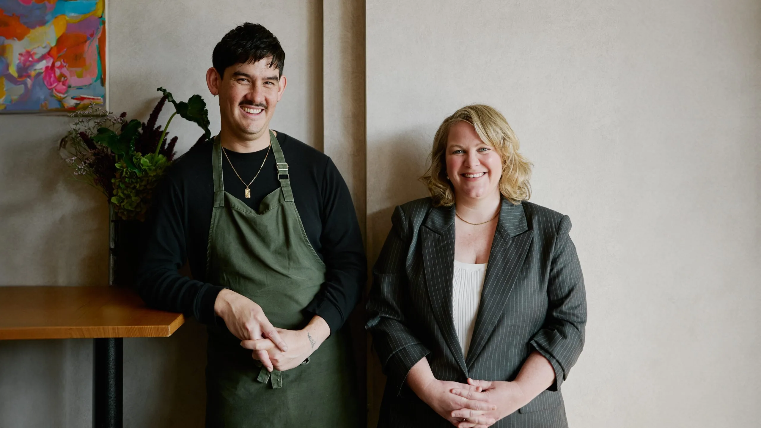 Lorcan Kan and Hannah Green stand together at Etta