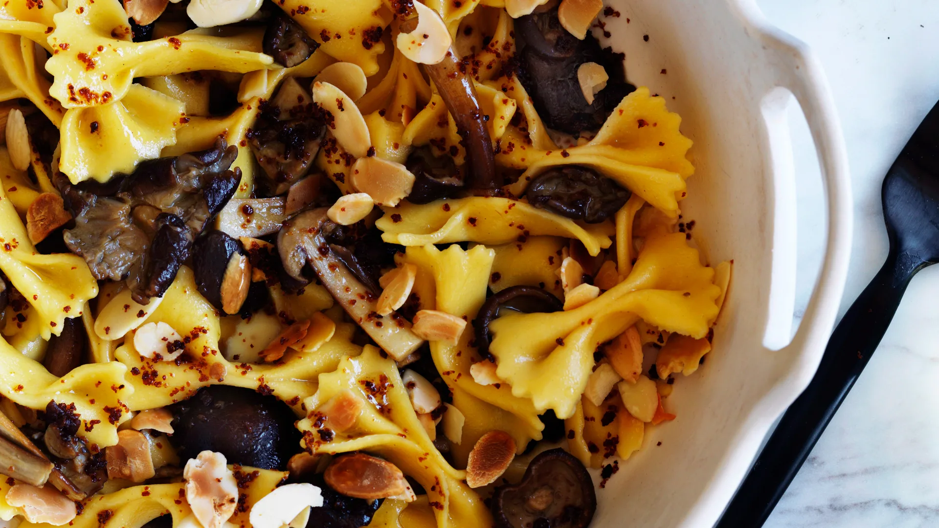 Pasta shapes: farfalle pasta with chestnut mushroom and almonds