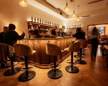 Bar Olo wine bar rin Carlton, Melbourne. People sitting at bar