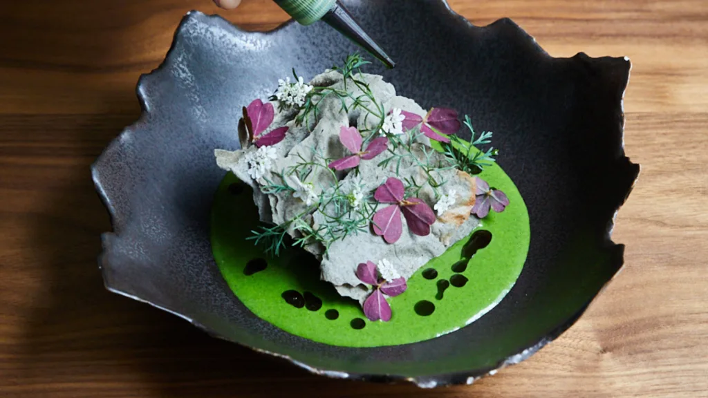 Crab, sunflower seeds green pippin with Thai basil and blue corn tostada at Quintonil in Mexico City