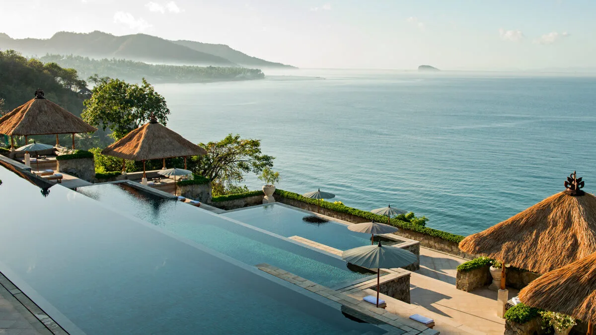 Tiered seimming pools leading down to ocean at Amankila Bali resort
