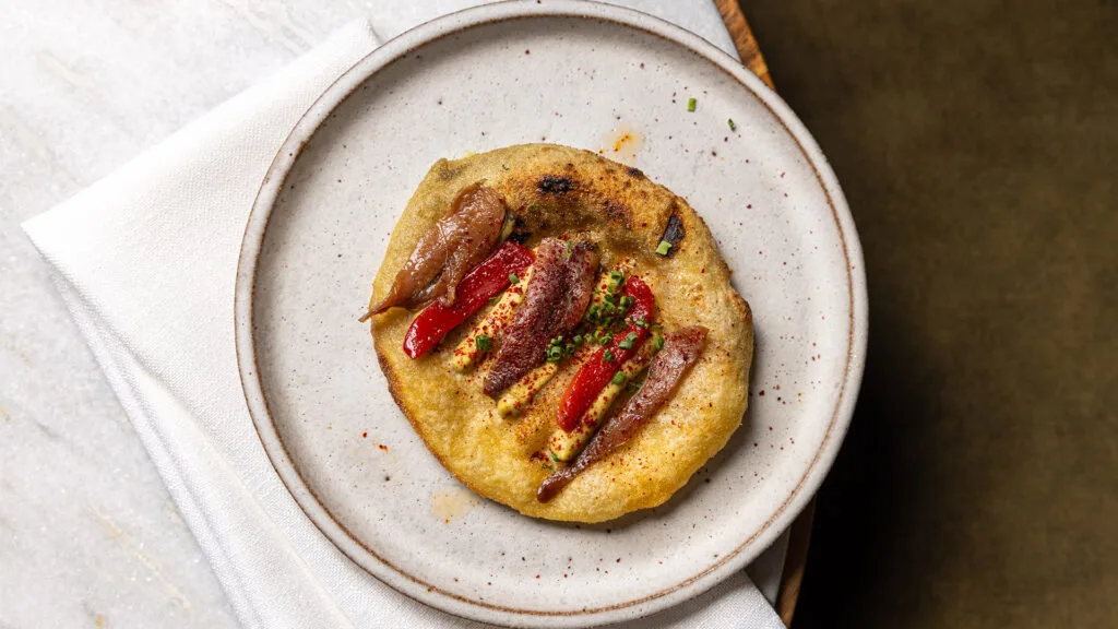 Flatbread on white plate at Bosco in Brisbane