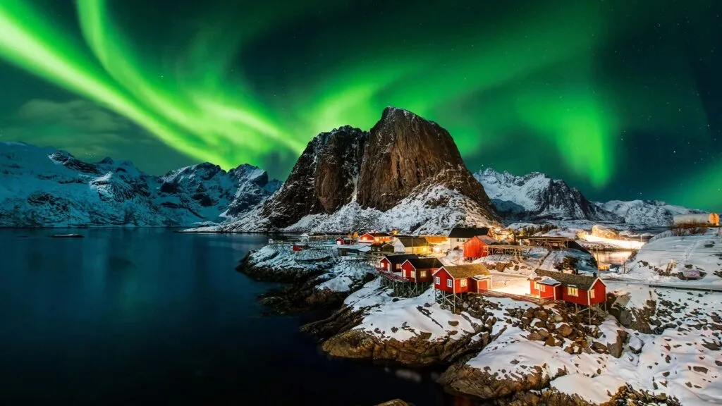 northern lights above a village