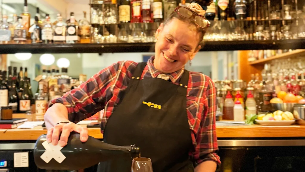 Photo of Sarah Hollway pouring a drink at Salopian Inn