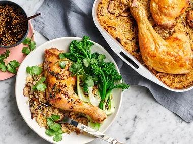 Dish of oven baked chicken with chilli and ginger dressing with side salad.