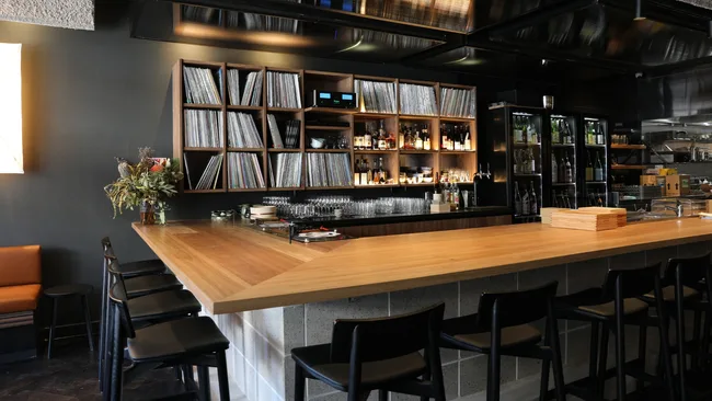The bar at Ante in Sydney's Newtown, surrounded by records and sake.