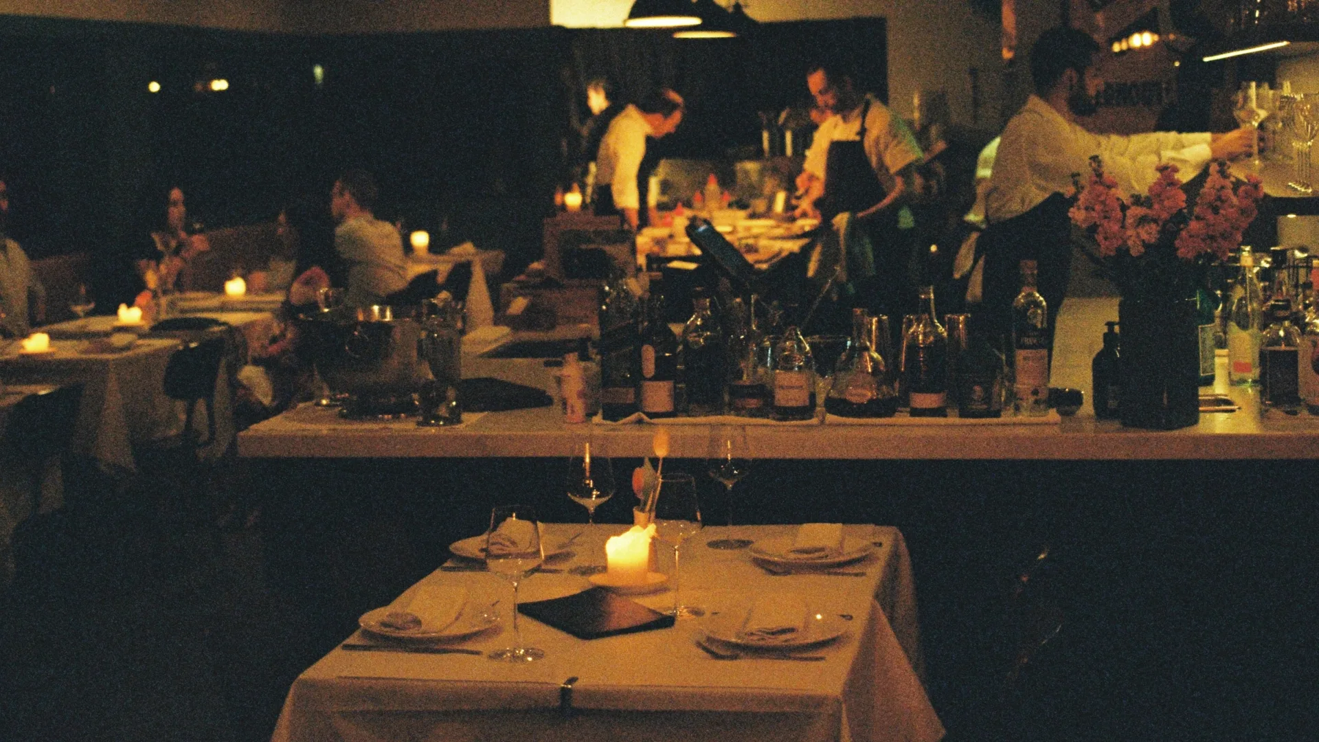 Moody, dim lighting in the dining room of Restaurant Labart in Burleigh Heads, Queensland.