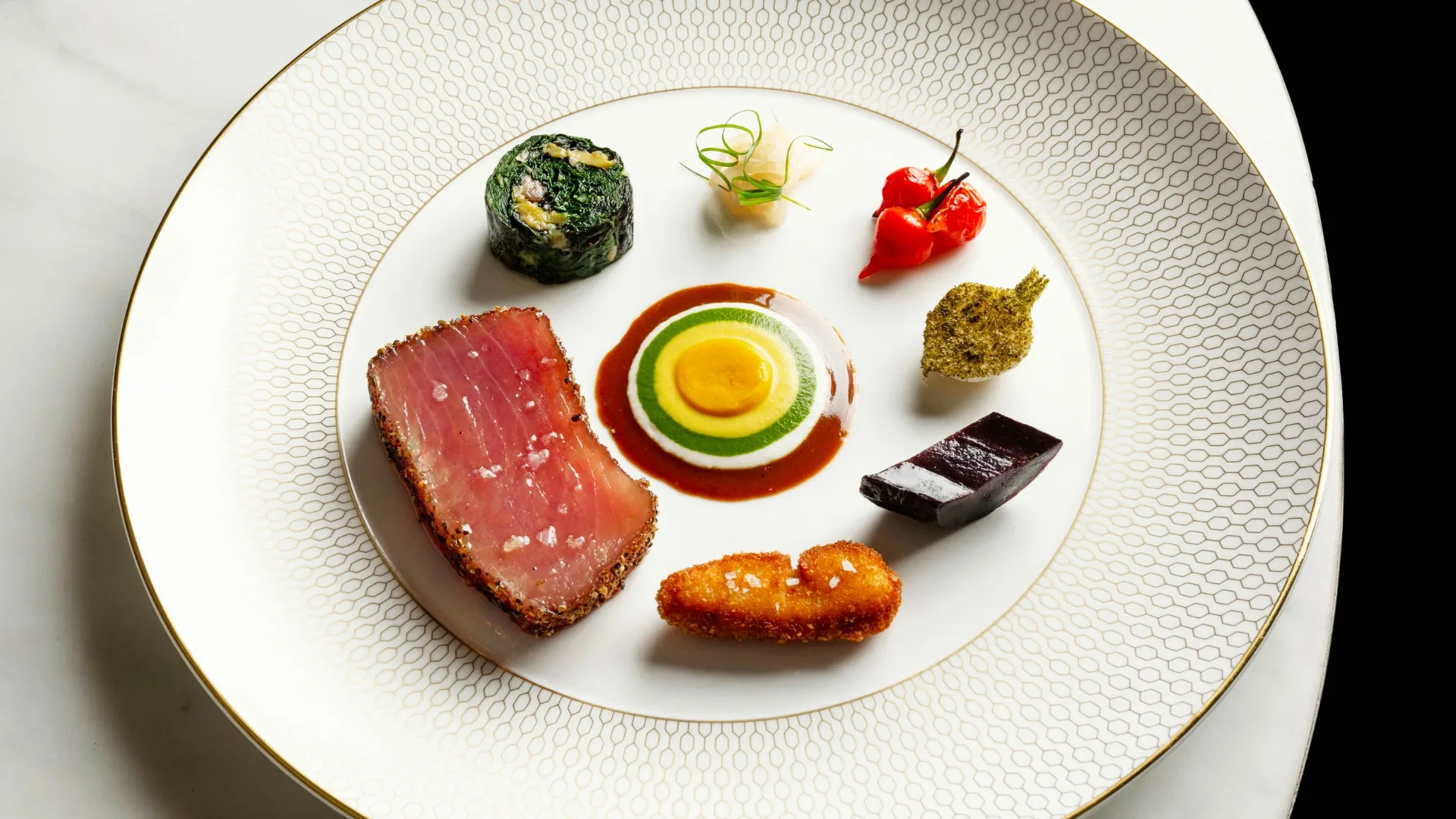 10-day dry-aged yellowfin tuna with an assortment of vegetables and purée at Saint Peter