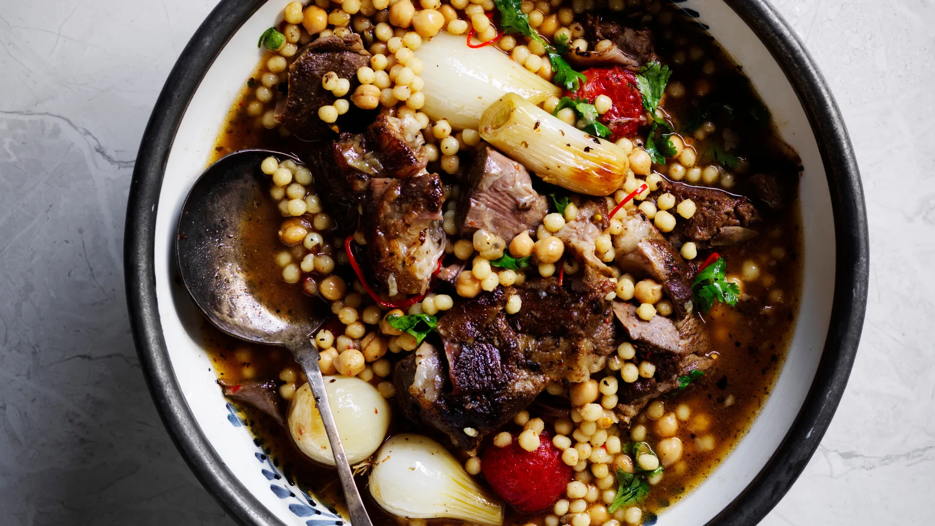 Greg Malouf's Baharat lamb shoulder with onions