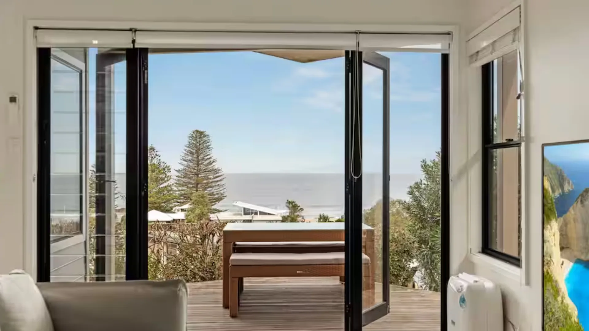 A private patio overlooks North Avoca beach at this coastal villa