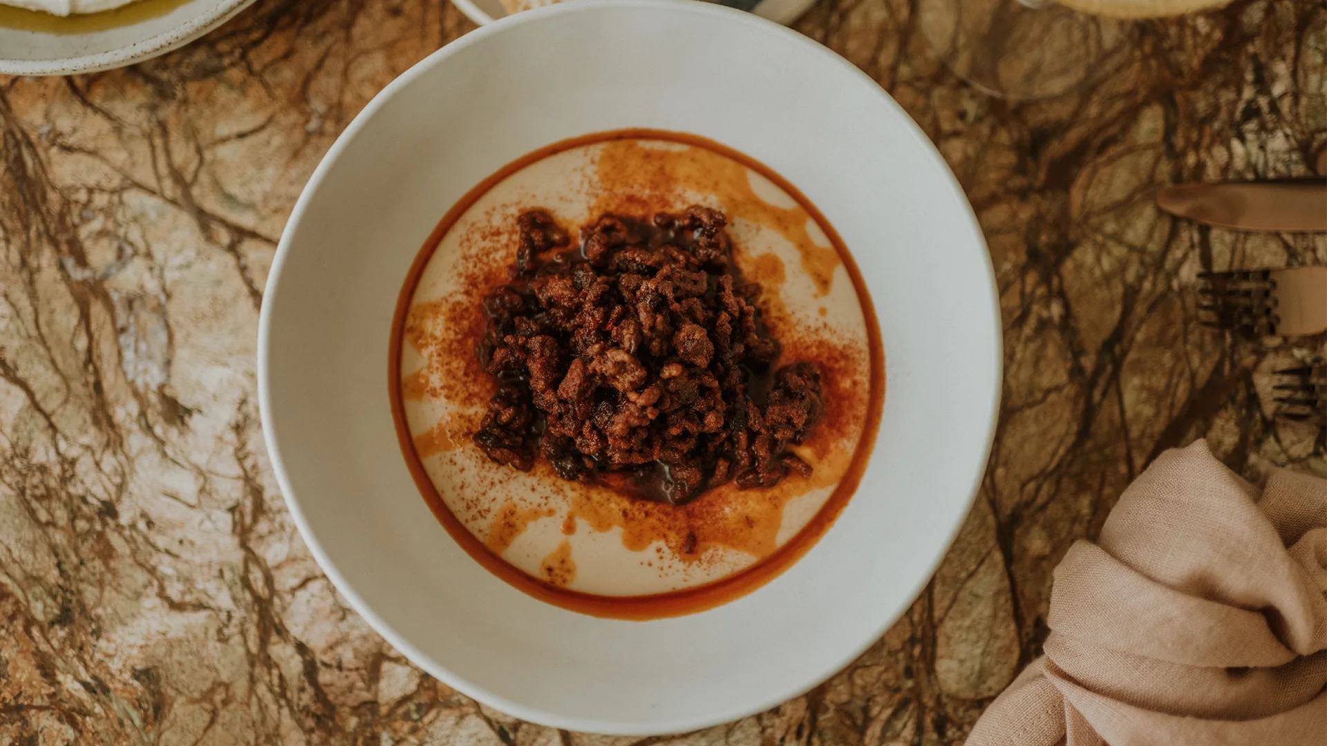 Raw wallaby with macadamia hummus sumac, Tasmanian paprika and mountain pepper at Maria restaurant.