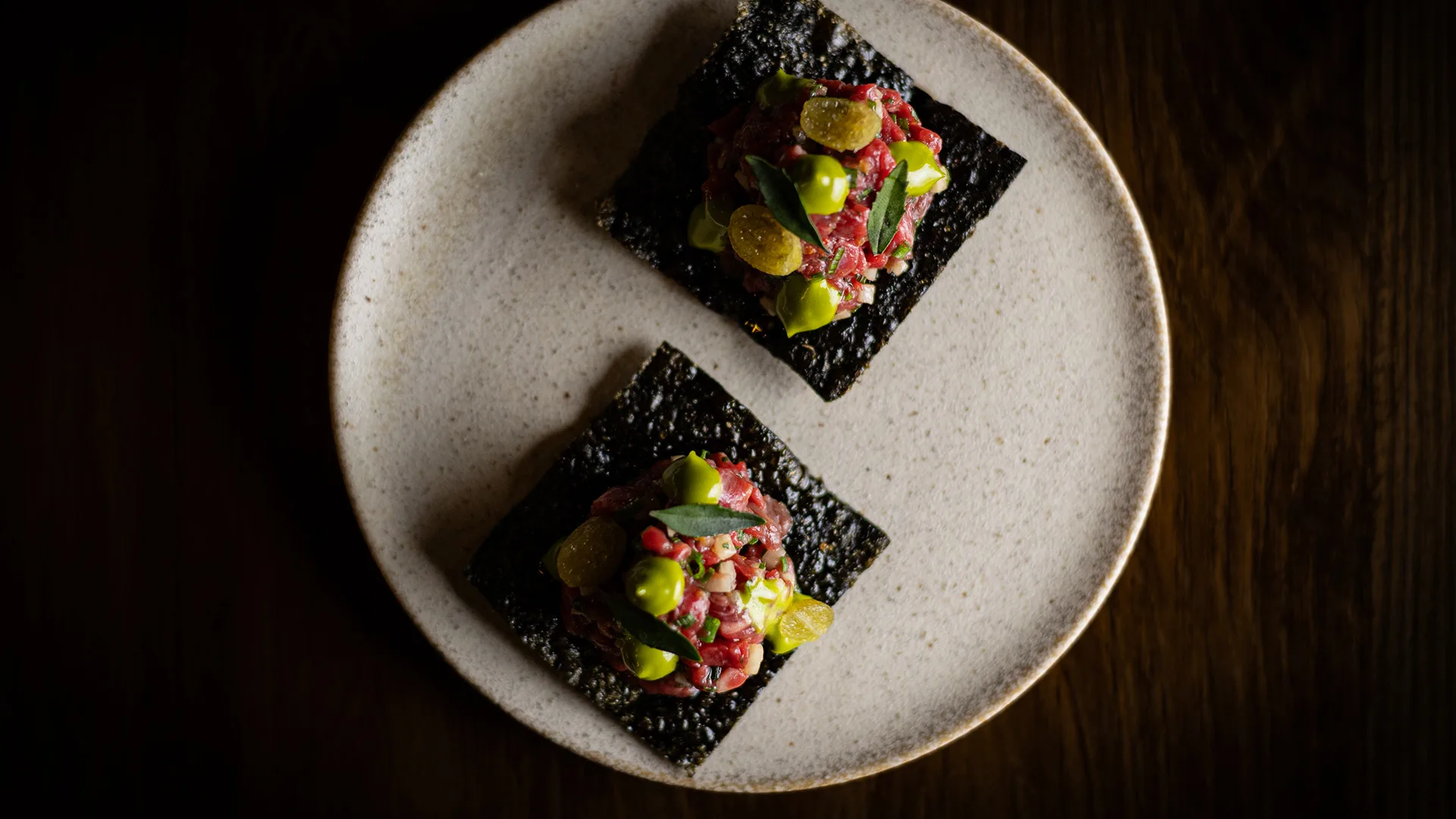 Retired dairy cow yukhwe, bugak, desert lime, dill emulsion at Doju, Melbourne