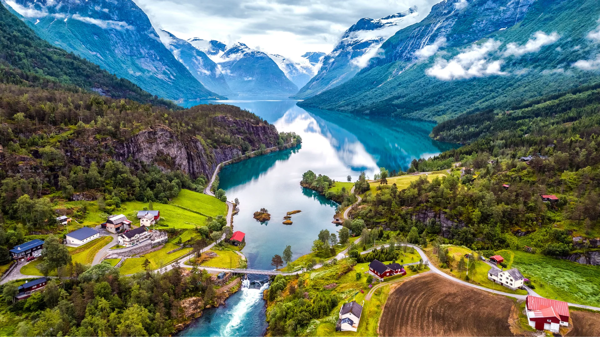 Geirangerfjord fjord in Norway with surrounding houses and mountains