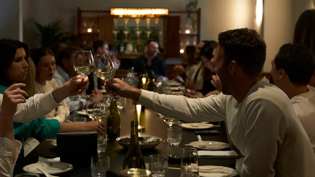 People toasting at Moonhouse's private dining room