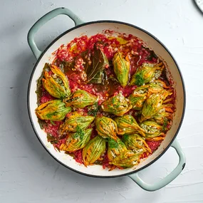 Zucchini flowers, brown rice, tomato, vine leaves, yoghurt