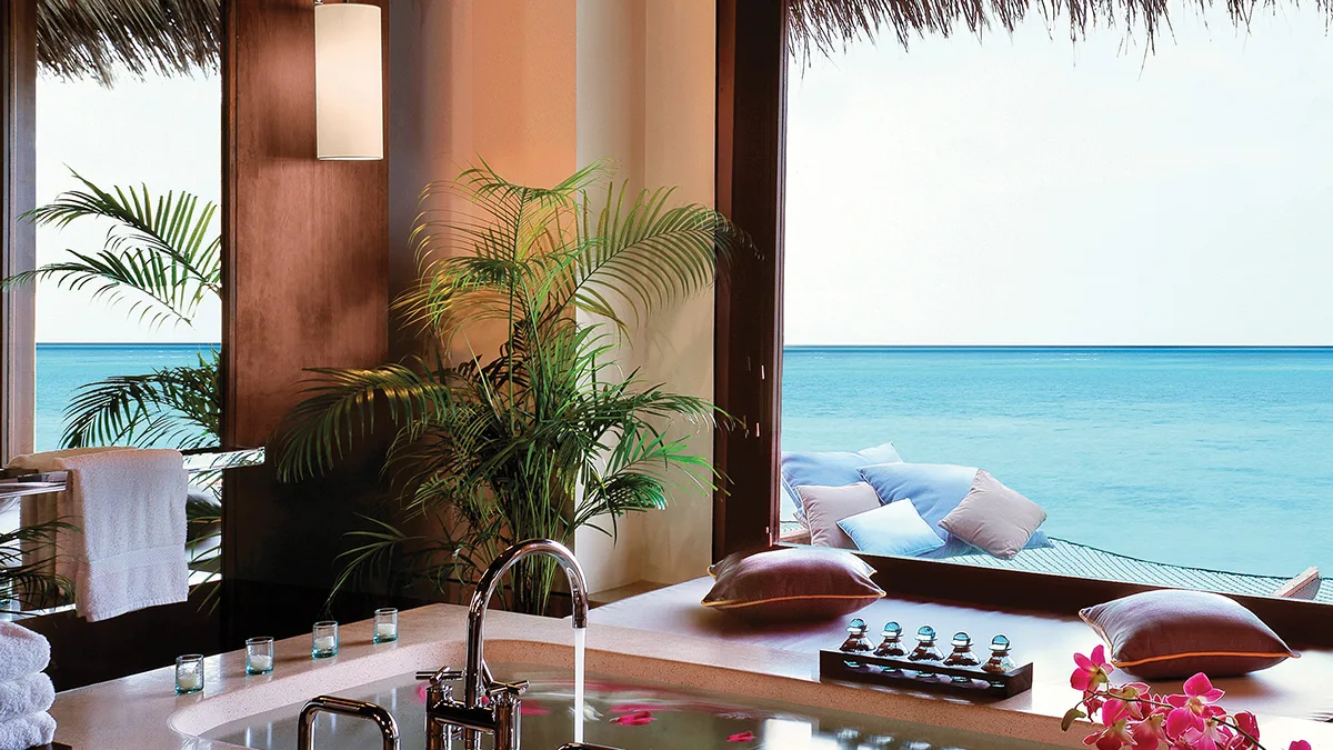 Beautiful blue ocean views in the overwater villa at One & Only Reethi Rah Maldives resort.