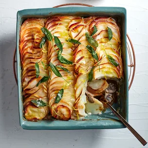 Potato and mushroom gratin with fried sage and black garlic butter