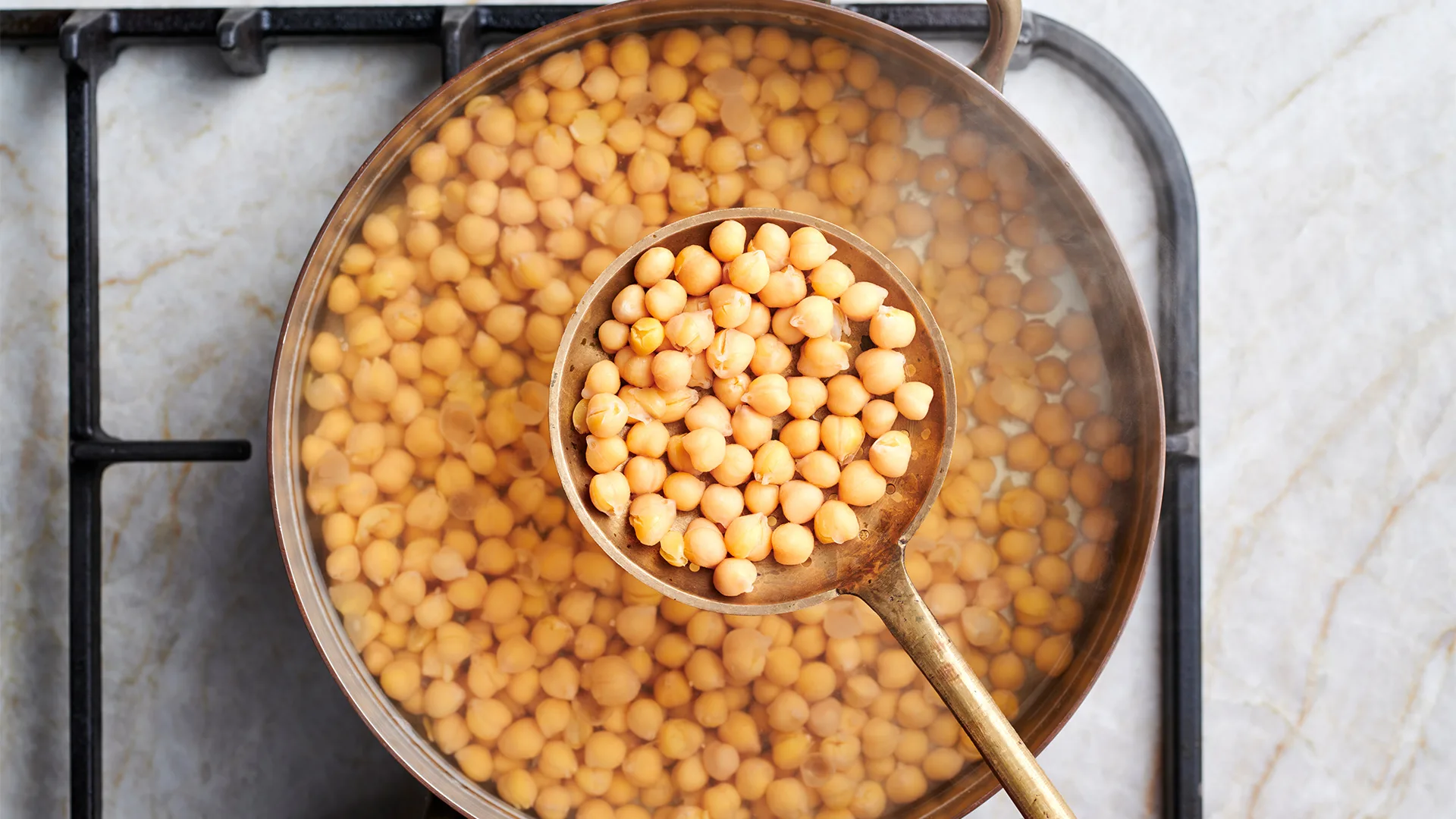 Straining chickpeas from water.