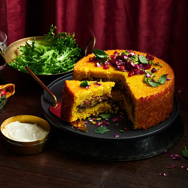 Tachin with caramelisewd onion, pomegranate and pistachios