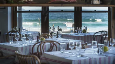 The interiros of Sean's Bondi looking out onto the crashing waves of Bondi Beach