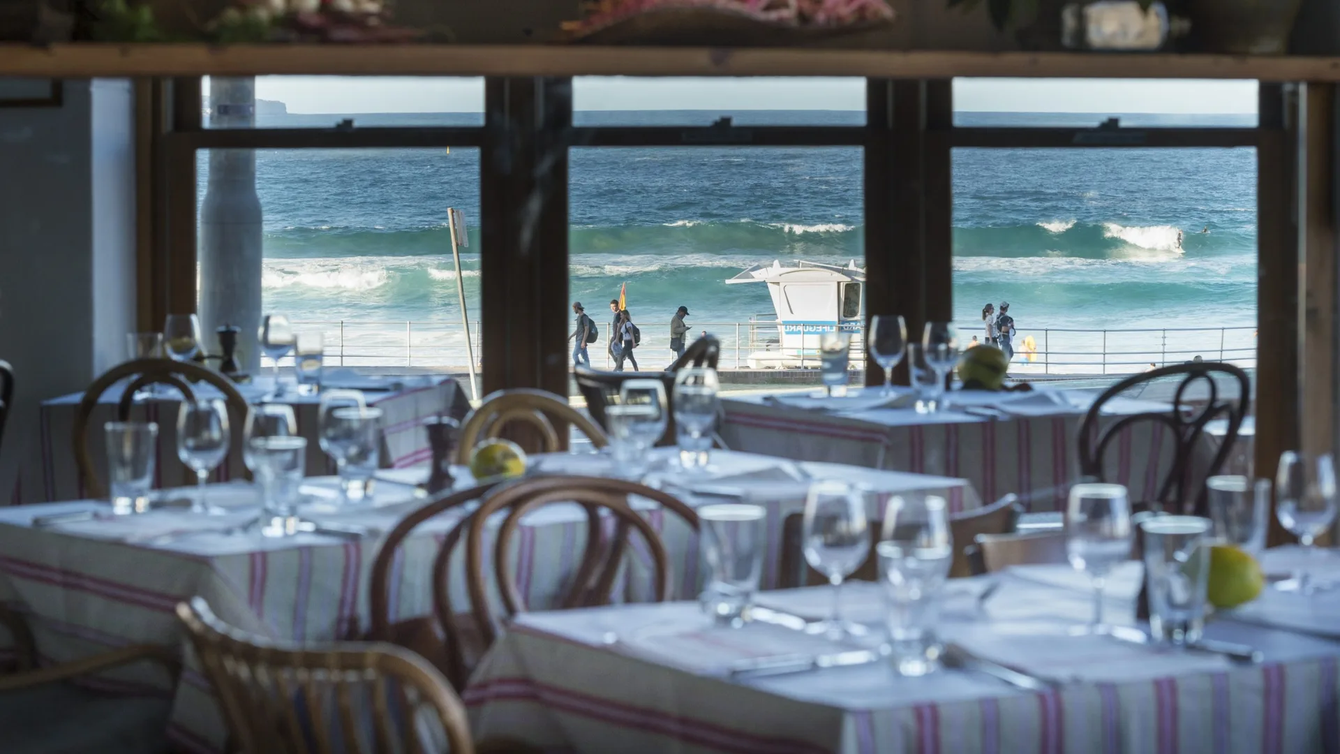 The dining room at Sean's Bondi with the view of Bondi Beach's crashing waves.