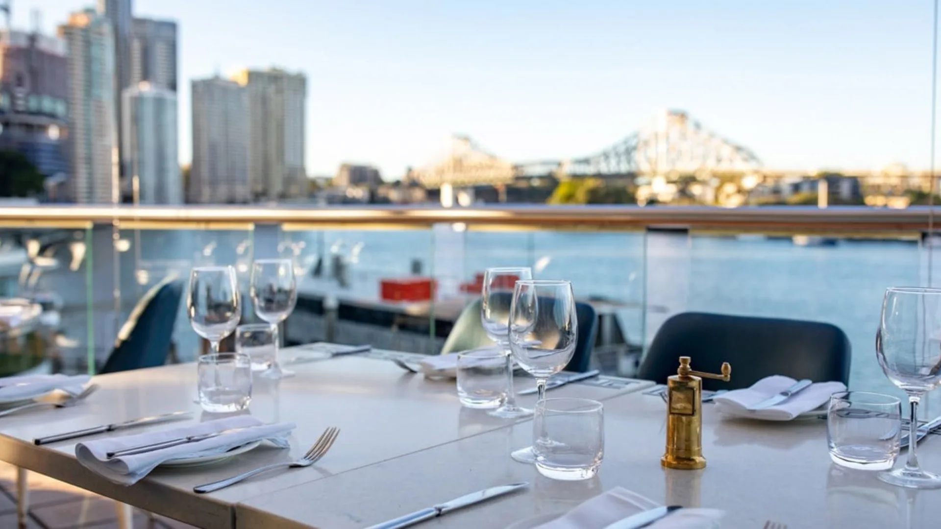 The outdoor dining at Fosh in Hamilton with views of the Story Bridge and the Brisbane River