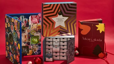 four luxury advent calendars set against a red background