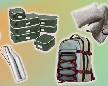 headphones, packing cubes, drink bottle, backpack against a colourful background