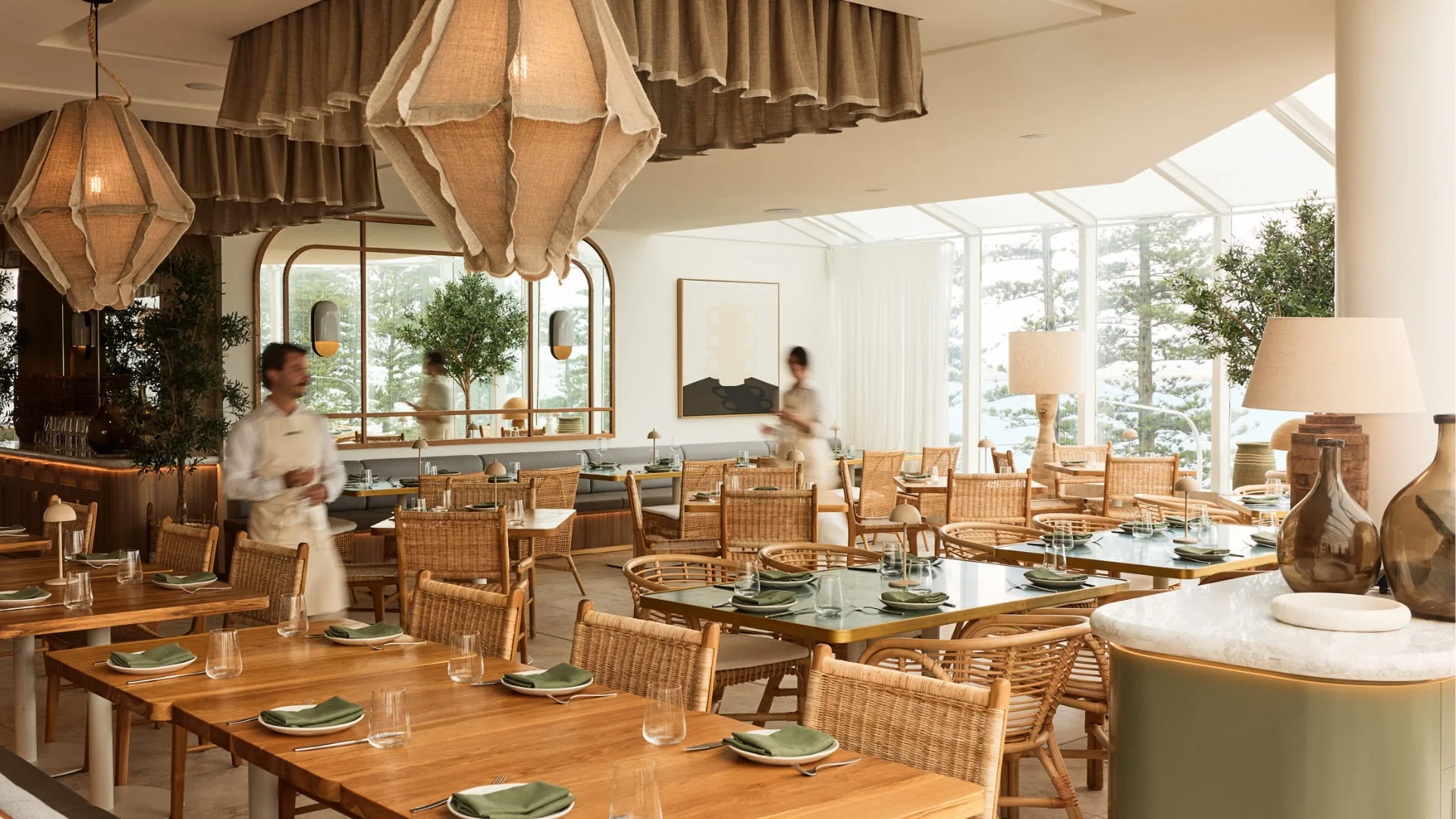 The neutral-toned, light-filled dining space at Ammos in Brighton Le Sands, Sydney
